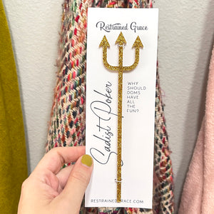 The Sadist Poker Paddle Restrained Grace Gold Glitter